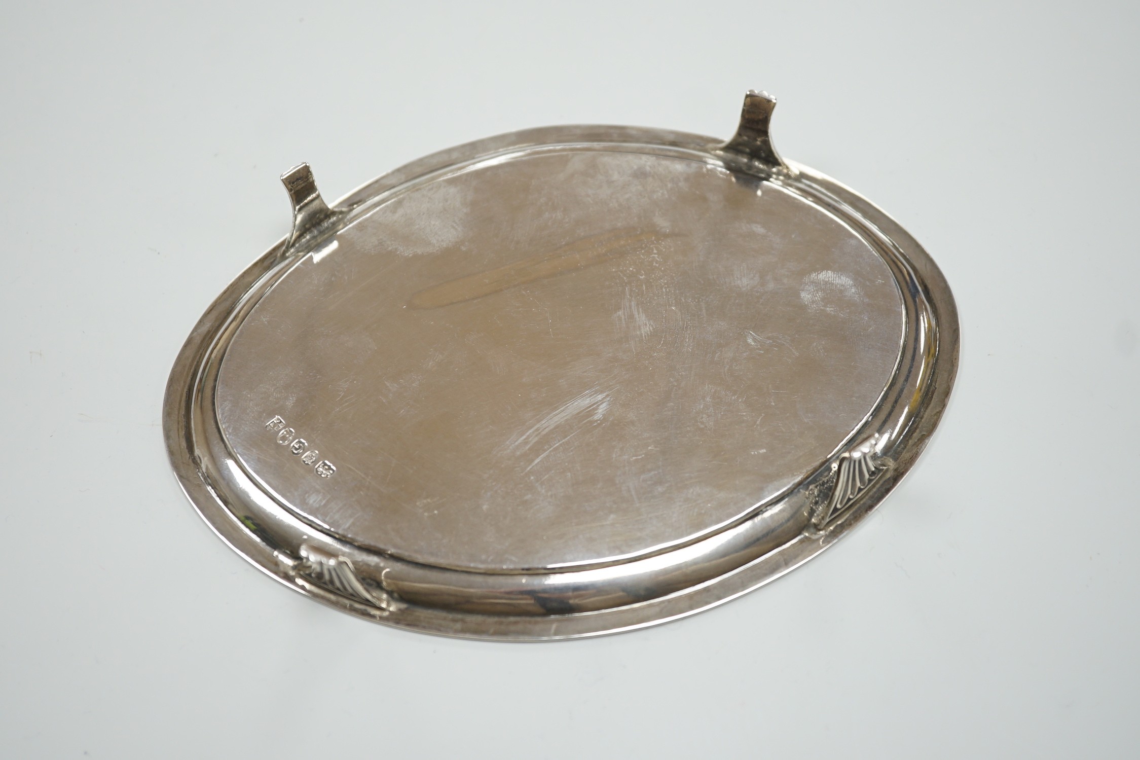 A George III silver oval teapot stand, by Peter, Ann & William Bateman, London, 1802, 18cm, 4.8oz, with reeded border, on four reeded feet.